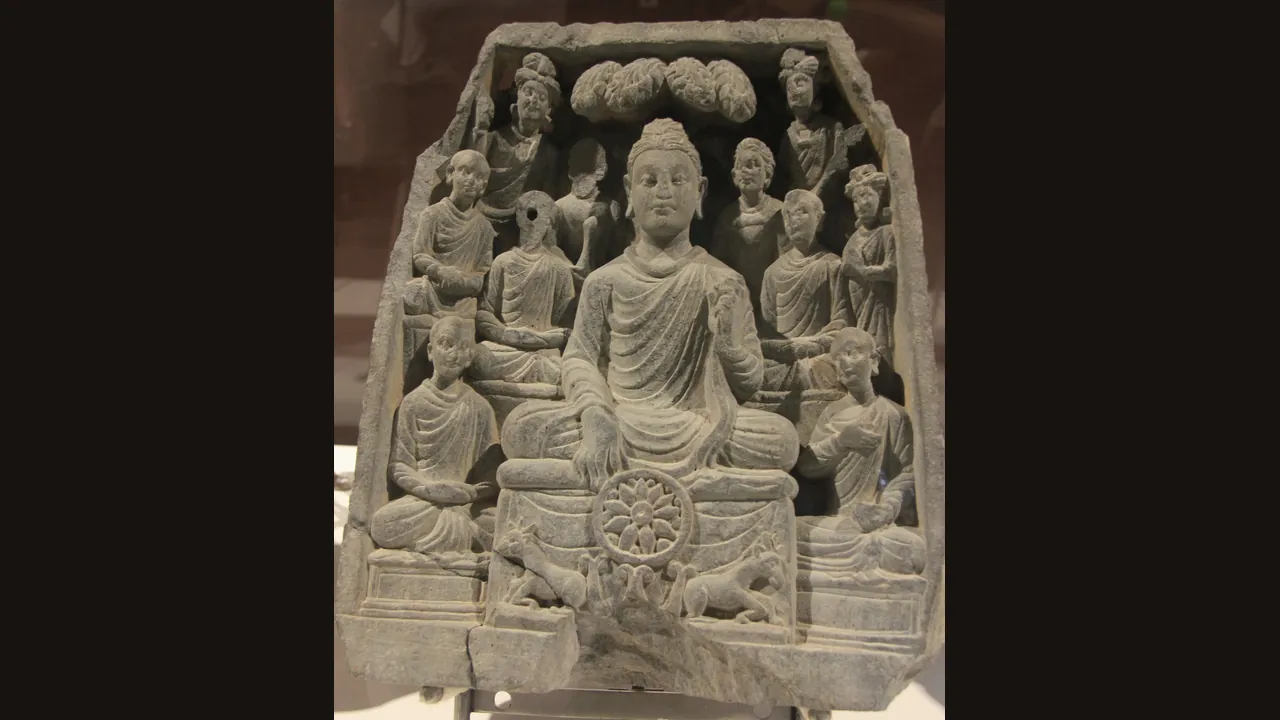 The Buddha preaching his first sermon, Gandharan stone relief (Wikimedia Commons, CC BY-SA)