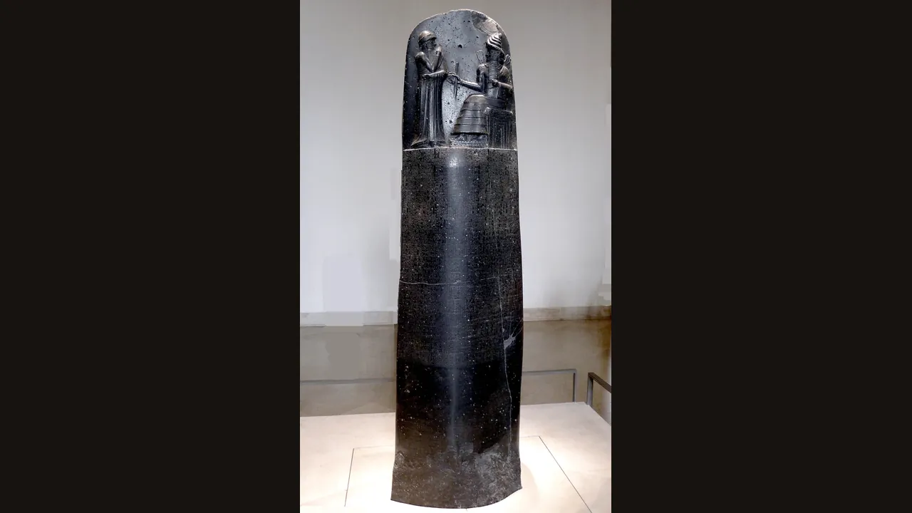 The Code of Hammurabi stele, showing the king receiving the laws from Shamash (Louvre, photograph via Wikimedia Commons)